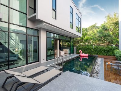 pool terrace and pink floating duck in infinity swimming pool